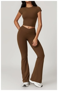 Macro view of cross V-waist yoga pants and cropped short sleeve top in dark brown