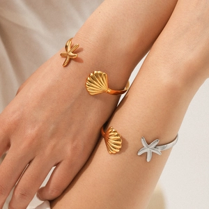 Starfish and seashell ocean themed gold and silver open cuff bracelets for women