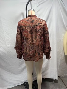 Detailed back view of a bohemian chiffon blouse with intricate paisley print and pleats