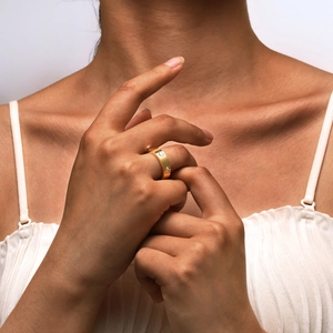 18K gold plated stainless steel ring with six heart-shaped zircons on a model