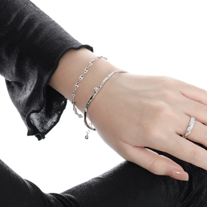Elegant silver irregular open bangle set with sparkling diamonds and textured rope details