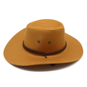 Close-up of brown suede cowboy hat with braided leather band and metal eyelet detail