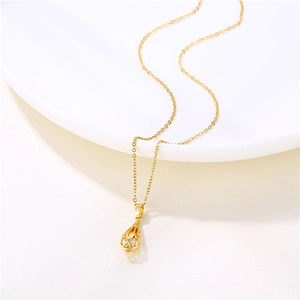 Collier avec pendentif goutte d'or 18 carats et zircon creux sur céramique blanche