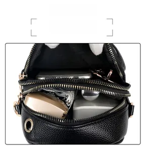 Detail view showing large capacity and double zipper structure of black crossbody phone bag