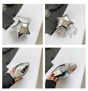 Detail view of the silver star-shaped acrylic clutch with metallic finish and chain strap