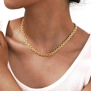 Elegant gold square brick link chain necklace worn on collarbone for a minimalist style