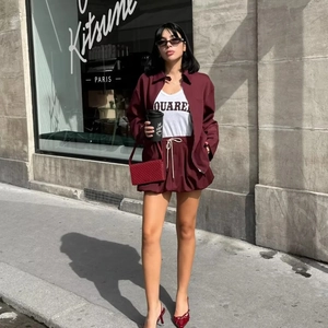 Fashionable burgundy long sleeve zipper jacket and matching drawstring shorts set