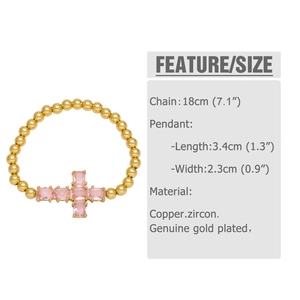 Detail view of gold beaded bracelet with pink zircon cross pendant and size specifications