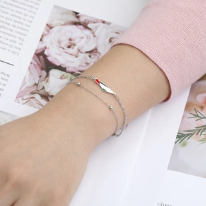 Detail of silver double-layered bead bracelet featuring a Palestine map enamel charm
