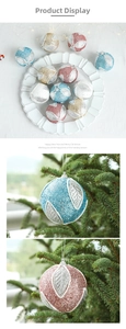 Macro shot of 8cm Christmas ball with glitter powder and silver leaf texture