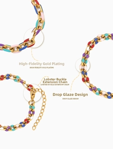 Detailed view of gold plated chain bracelet with colorful enamel links and lobster clasp