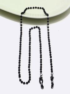 Detail of black bead eyewear chain featuring secure lobster clasps and rubber loops