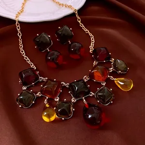 Vintage gold necklace and earring set with colorful resin gemstone pendants