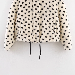 Cream fleece hooded jacket with black heart print and drawstring hem for women