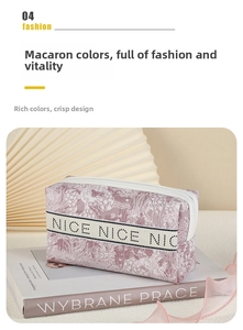 Detail of pink embossed floral makeup bag with NICE ribbon and metal zipper closure