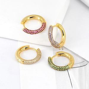Detailed macro of gold-plated S925 silver hoop earrings with vibrant colorful zircons
