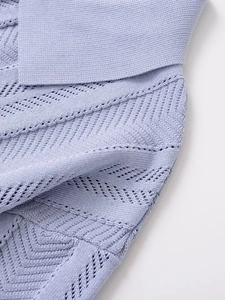 Detail shot of lavender knitted top showing hollow-out texture and soft fabric