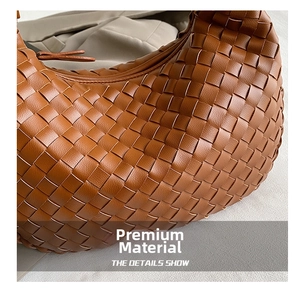 Close-up of caramel leather woven hobo bag showing the intricate handcrafted knot details
