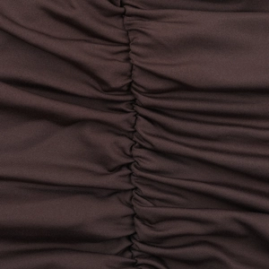 Detail of ruched center seam on dark brown knit bodycon dress fabric texture