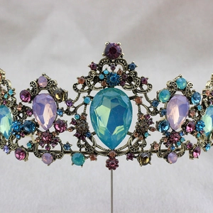 Detailed close-up of vintage gold bridal crown with colorful crystals and rhinestones