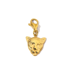 Detail of leopard head pendant in gold finish with lobster clasp and textured surface