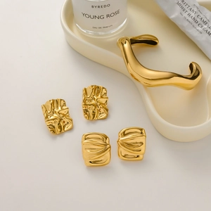 Modern gold plated tiger eye stone jewelry set with irregular textured bangle and stud earrings