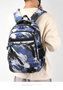 Rear view of camouflage backpack with blue and black patterns and adjustable straps