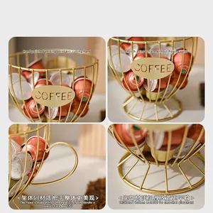 Golden cup-shaped metal coffee capsule holder with hollowed COFFEE logo and handle