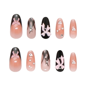 Handmade press-on nails with bowknot and heart pattern in long almond shape