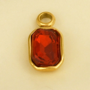 Macro shot of rectangular red glass gemstone pendant in a gold stainless steel frame