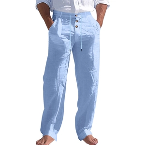 Detail of light blue linen pants showing fabric texture, drawstring, and button fly design