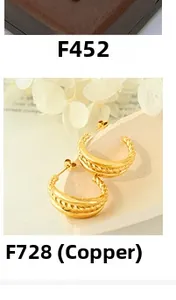 Close-up of gold-plated twisted rope texture and smooth finish brass hoop earrings