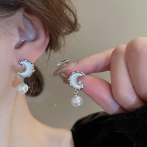 Elegant silver moon and pearl drop earrings featuring white opal moon and zircon accents