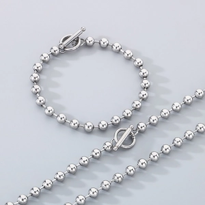Polished silver beaded necklace and bracelet set with OT toggle clasp closure