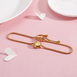 Detail of gold Sagittarius bracelet with cubic zirconia and adjustable slide clasp