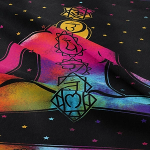 Detailed close-up of soft fabric texture with vibrant yoga seven chakra symbols print
