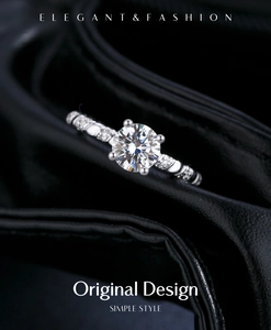 Macro shot of 1ct moissanite ring with classic four-prong setting and twisted diamond band