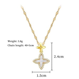 Close-up of gold clover necklace with mother of pearl star pendant and crystals