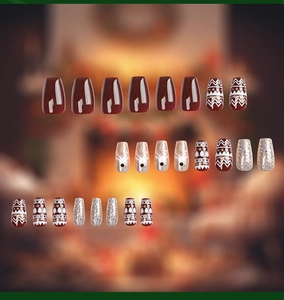 Detailed set of Christmas coffin nails with elk, glitter, and red wave patterns