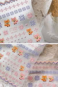 Detail of pixel art nail stickers MN-167F featuring 3D embossed foxes and snowflakes