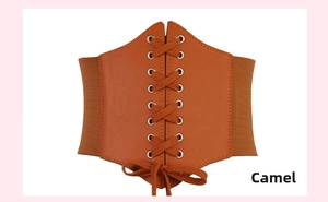 Detail view of camel PU leather corset belt with retro cross lace-up design and silver eyelets