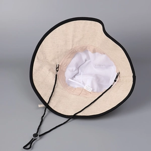 Linen cotton sun hat with wide brim, beige fabric with black trim and windproof chin strap