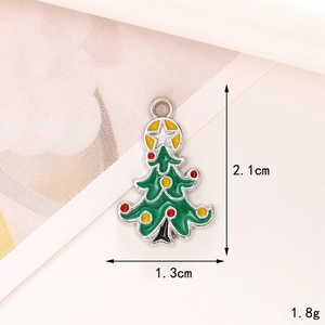 Zinc alloy Christmas tree pendant with green enamel and measurements 2.1cm by 1.3cm