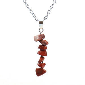 Detailed view of handmade necklace with seven red natural agate stones on silver chain