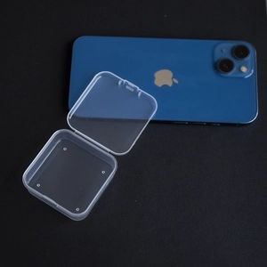 Clear square PP plastic storage box shown with a smartphone for size reference