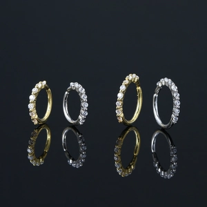 Surgical stainless steel hoop earrings with micro-inlaid cubic zirconia in gold and silver
