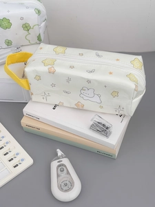 Detail of cute rabbit print pencil case with large capacity and portable yellow handle