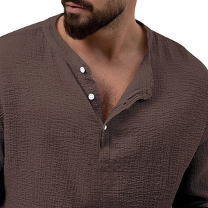 Detailed view of coffee brown waffle knit long sleeve shirt with buttoned henley neckline