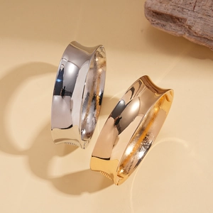 Minimalist wide metal cuff bracelets in gold and silver finish with geometric glossy design