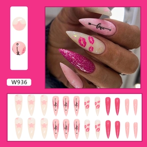 Pink stiletto press-on nails with love heart and star patterns for Valentine's Day